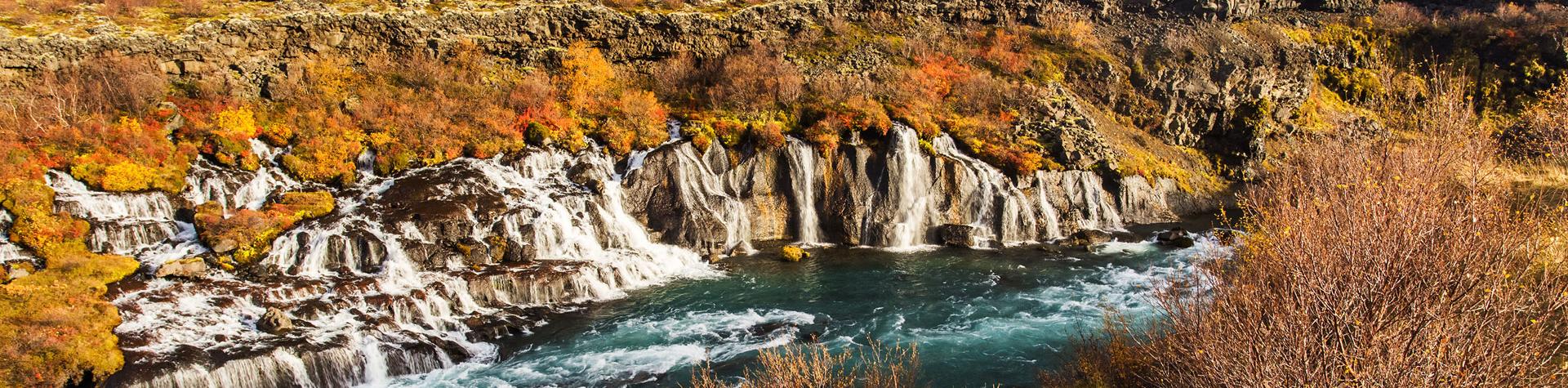 Waterfall Hraunfoss in autumn Iceland.