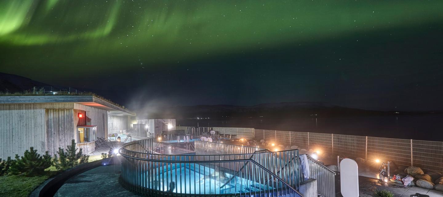 Geothermal bathing under the northern lights in Iceland.